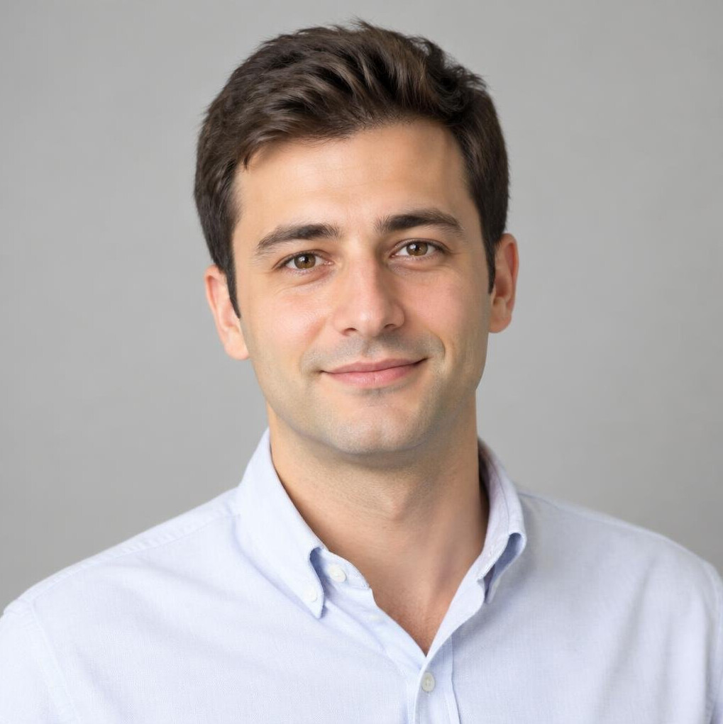 Portrait of a young man in a light shirt with a neutral expression